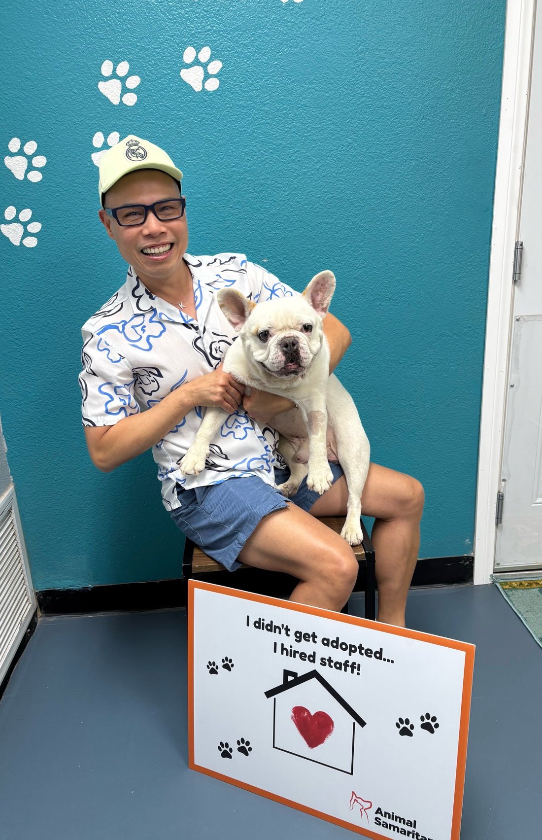 A smiling Cruz Eberle Foundation supporter holding Pascal, a rescue dog