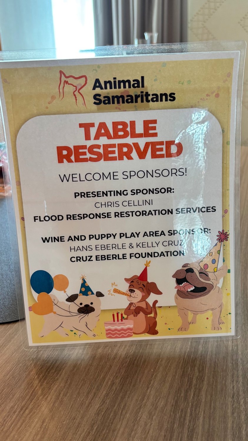 Animal Samaritans sponsor table sign recognizing Cruz Eberle Foundation