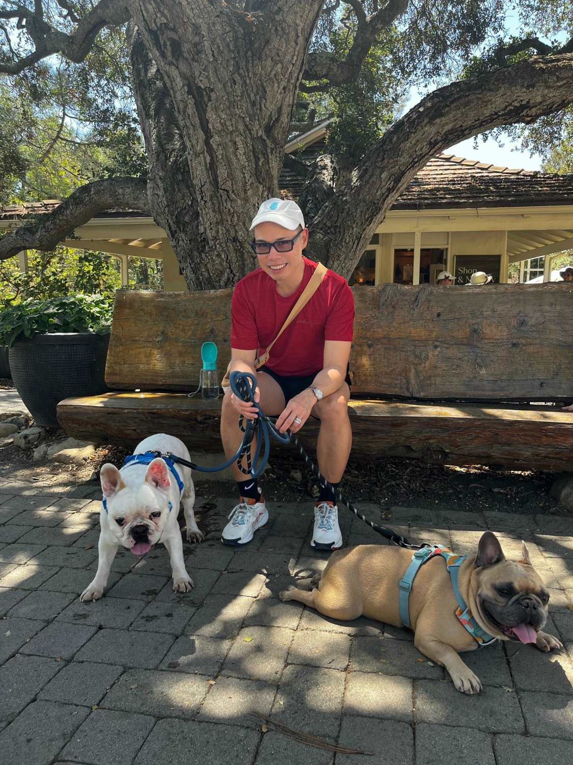 Henri and Pascal resting with a Cruz Eberle Foundation supporter under a tree